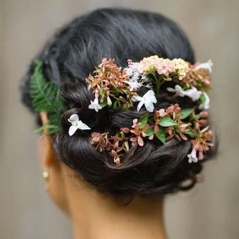 high bun with floral embellishments