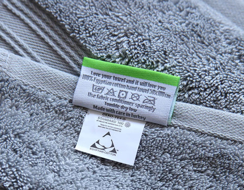Close up of grey Egyptian cotton authentication and care labels