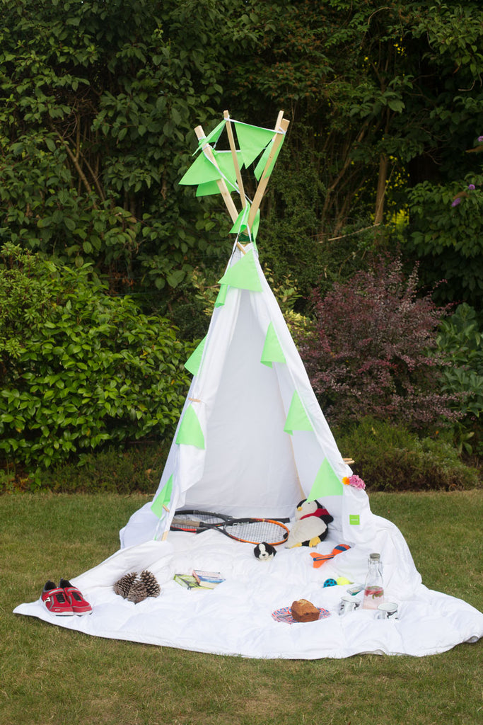 Teepee Made From Old Sheets in a Garden | scooms
