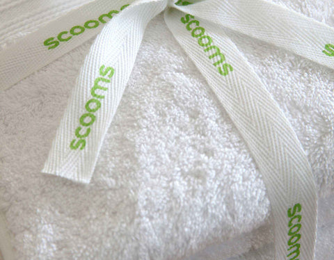 White cotton towel bale close up tied with scooms branded ribbon