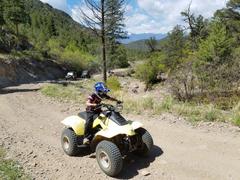 Just old enough to ride the Quad at Texas Creek