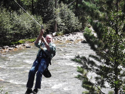 My Pa zip-lining across the river