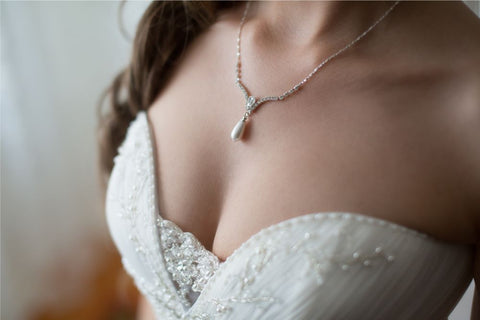 lady with wedding dress and necklace