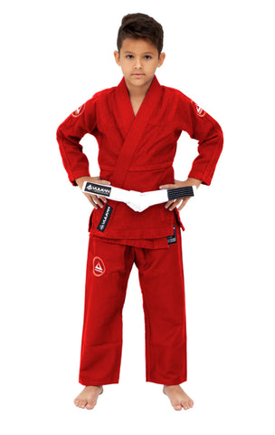 young boy wearing red jui jitsu armor