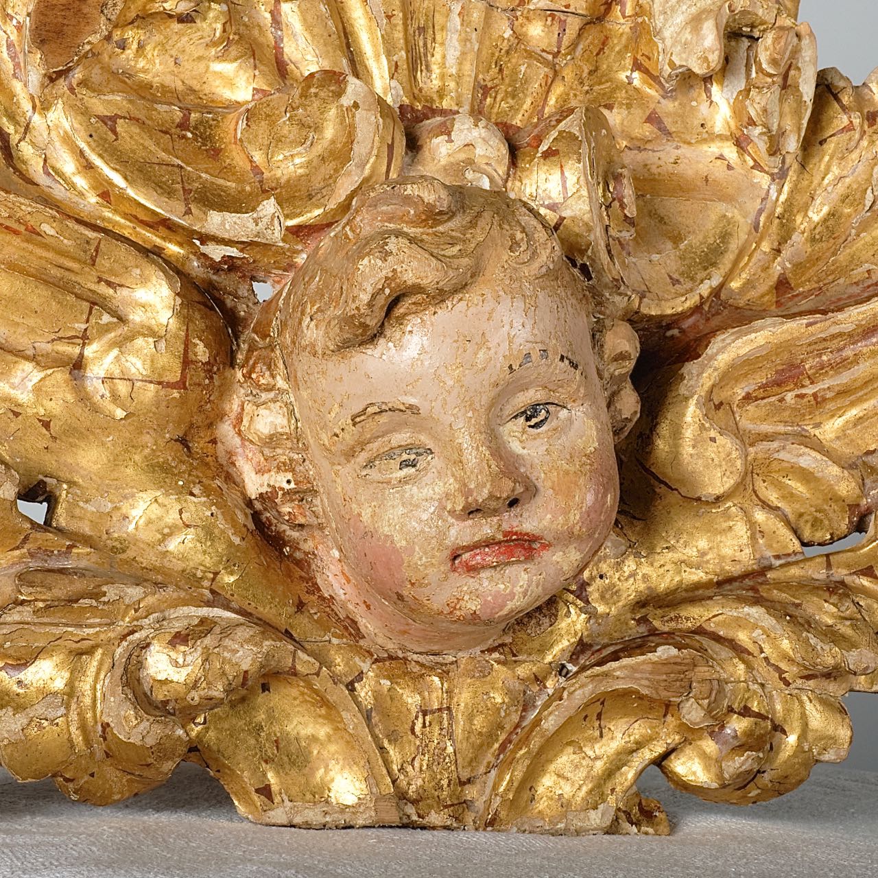 Antique carved and gilt Baroque cherub s head, pine