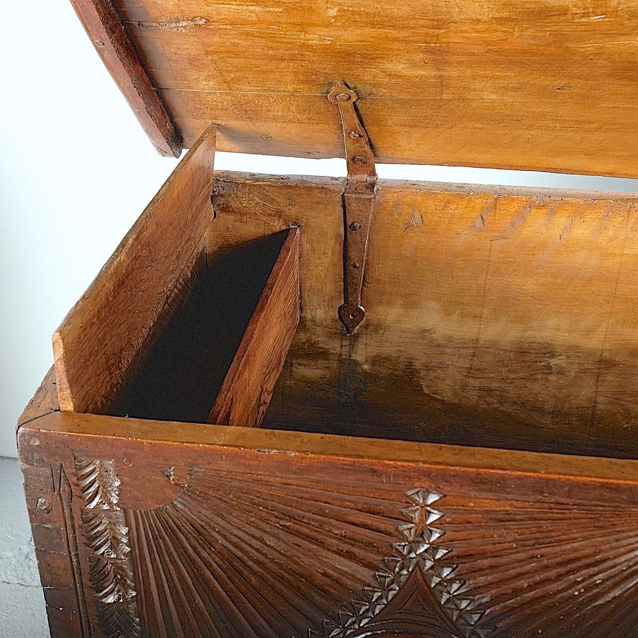 Antique heavily carved Basque arms chest, walnut