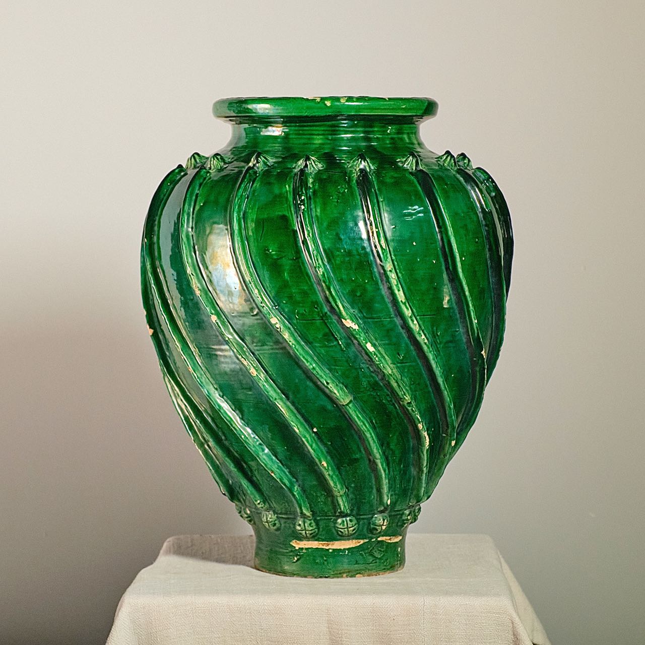Antique glazed green ribbed olive oil jar