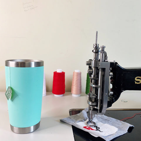 singer114w103 chainstitch embroidery machine and seafoam yeti mug