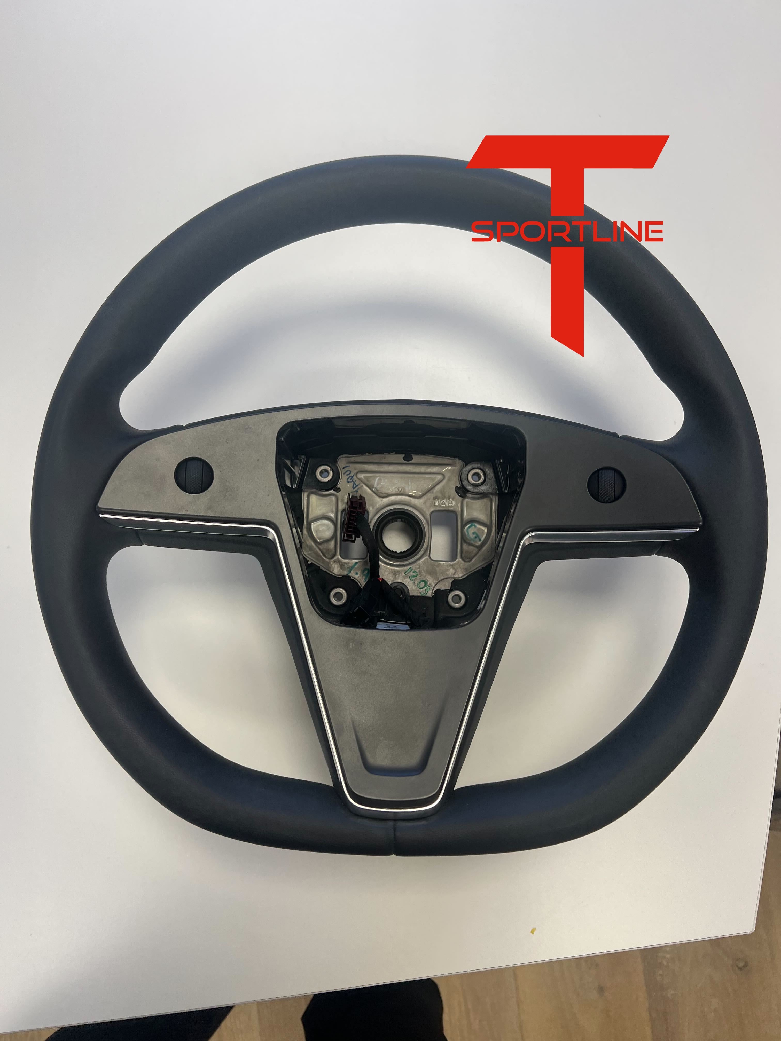 2023Tesla_Model_S_Paid_Round_Steering_Wheel.jpg
