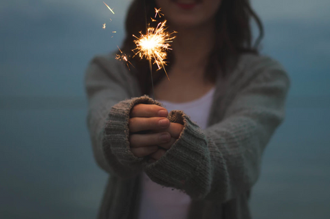 woman holding sparkler