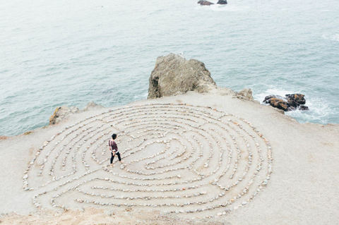 person in a maze on the beach