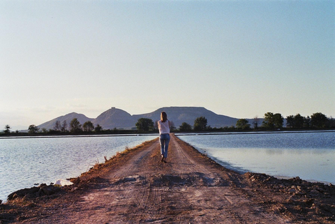 Girl walking down a path