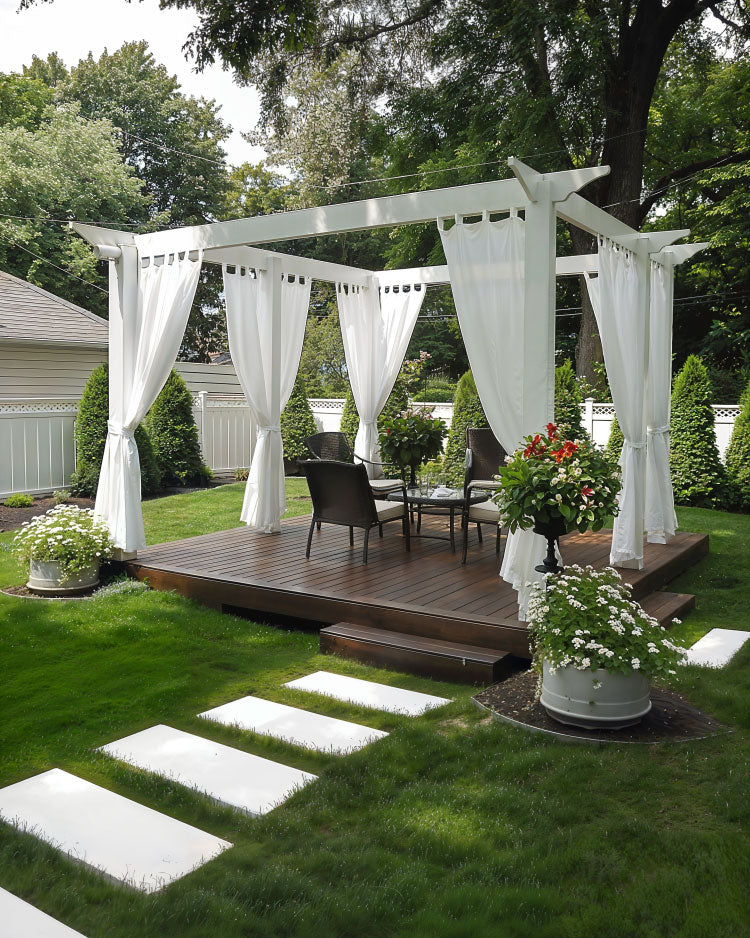 ground deck platform idea with gazebo design, white cloth curtains, outdoor dining, white pavers in lawn leading to deck platform