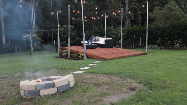 deck, deck build, garden, garden design, festoon lights, plants, deck decor, outdoor decor, fire pit, pavers, lawn, candle