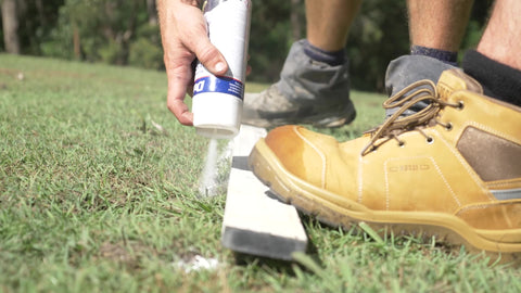 straightedge, safety footwear, spray paint, soil, turf, boot