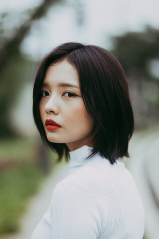 Portrait of Asian woman in white dress 