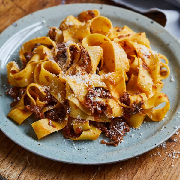 Our Guide to Making Pappardelle Pasta - Pasta Evaneglists - pile of pappardelle al ragu