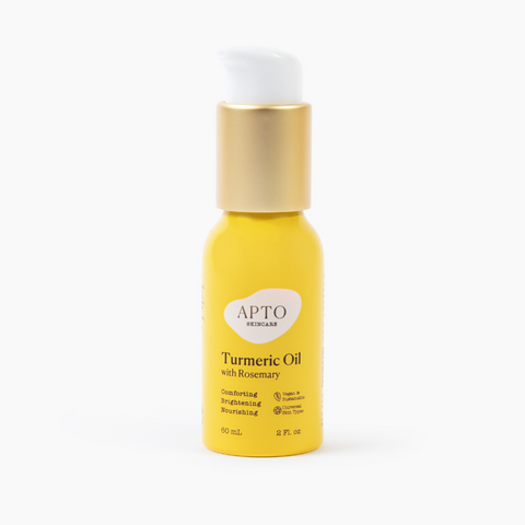 APTO Skincare Turmeric Oil with Rosemary in a yellow aluminum bottle with a white pump