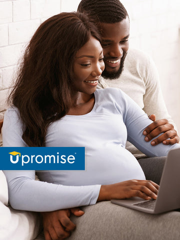pregnant couple starting upromise account on computer