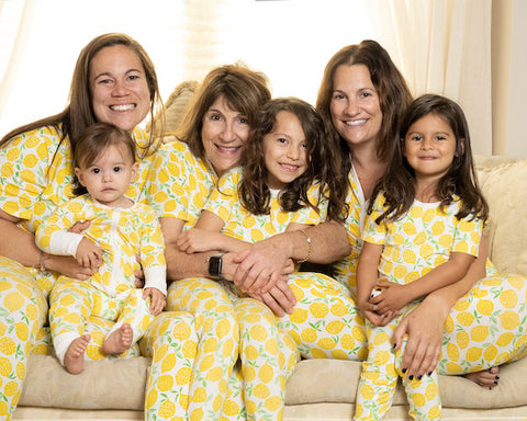 family of girls dressed in matching pajamas