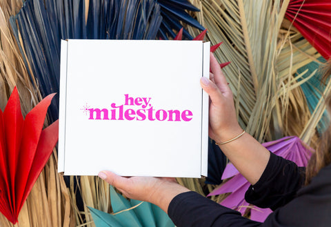 new hey milestone box against colorful background