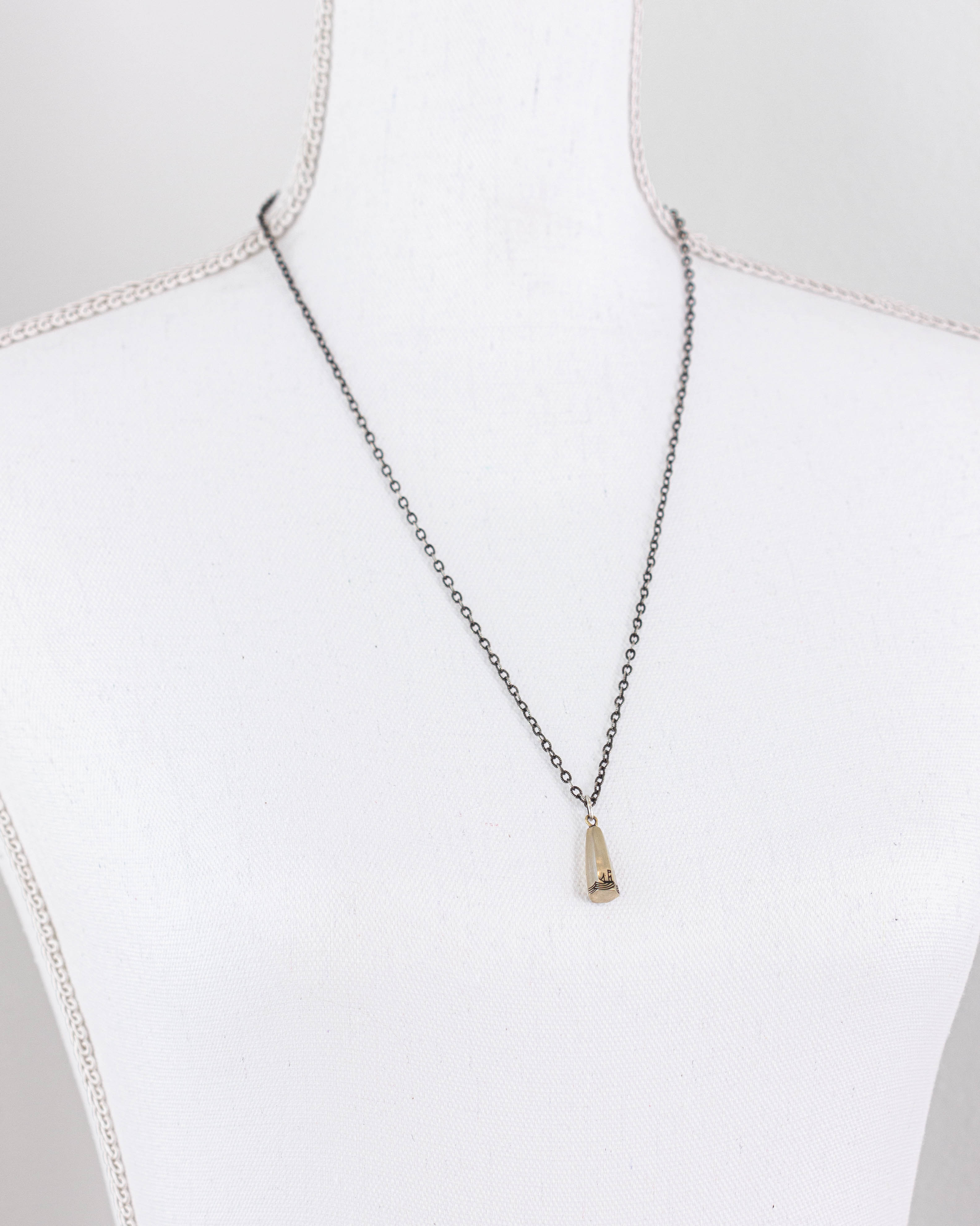 Sounding Weight Necklace in Silver & Brass