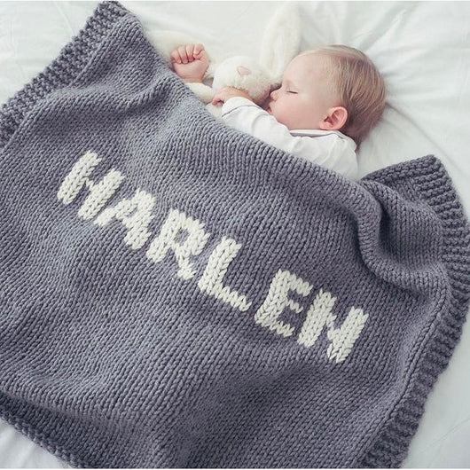baby blanket with name printed all over it