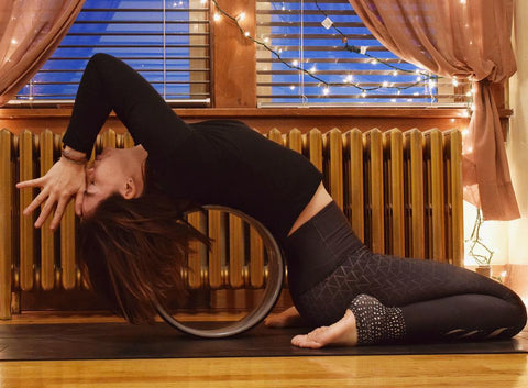 Clarissa May on yoga wheel