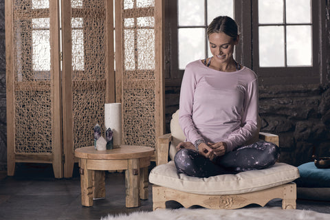 girl sits on meditation chair