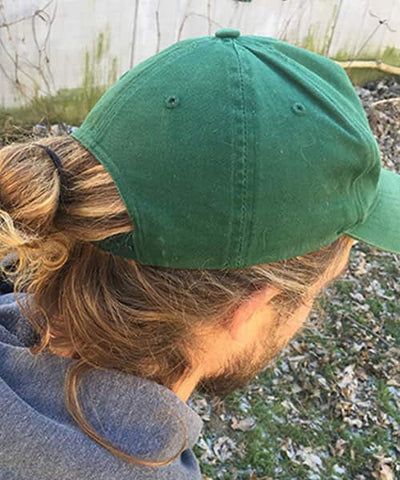 Rocking A Baseball Cap With Long Hair