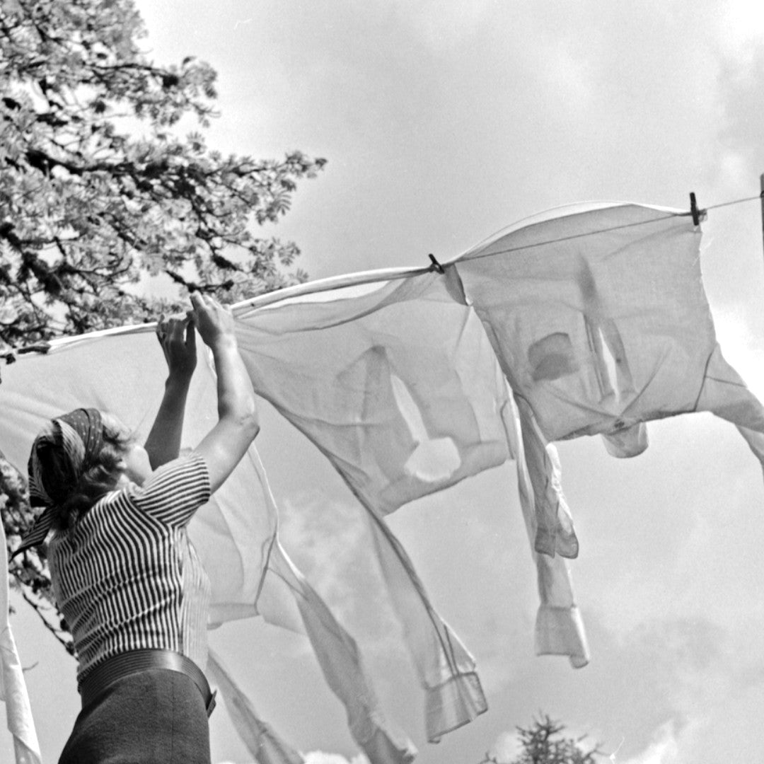 Image of a washing line with shirts on it from the 1940s