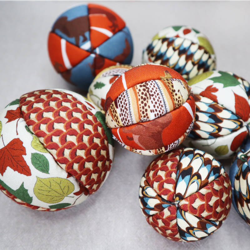 Photo of a group of fabric christmas baubles.