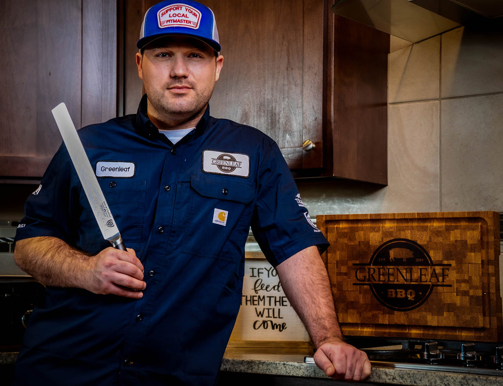 Chef Spotlight: James Greenleaf (@greenleaf.bbq) holding a Dalstrong carving knife