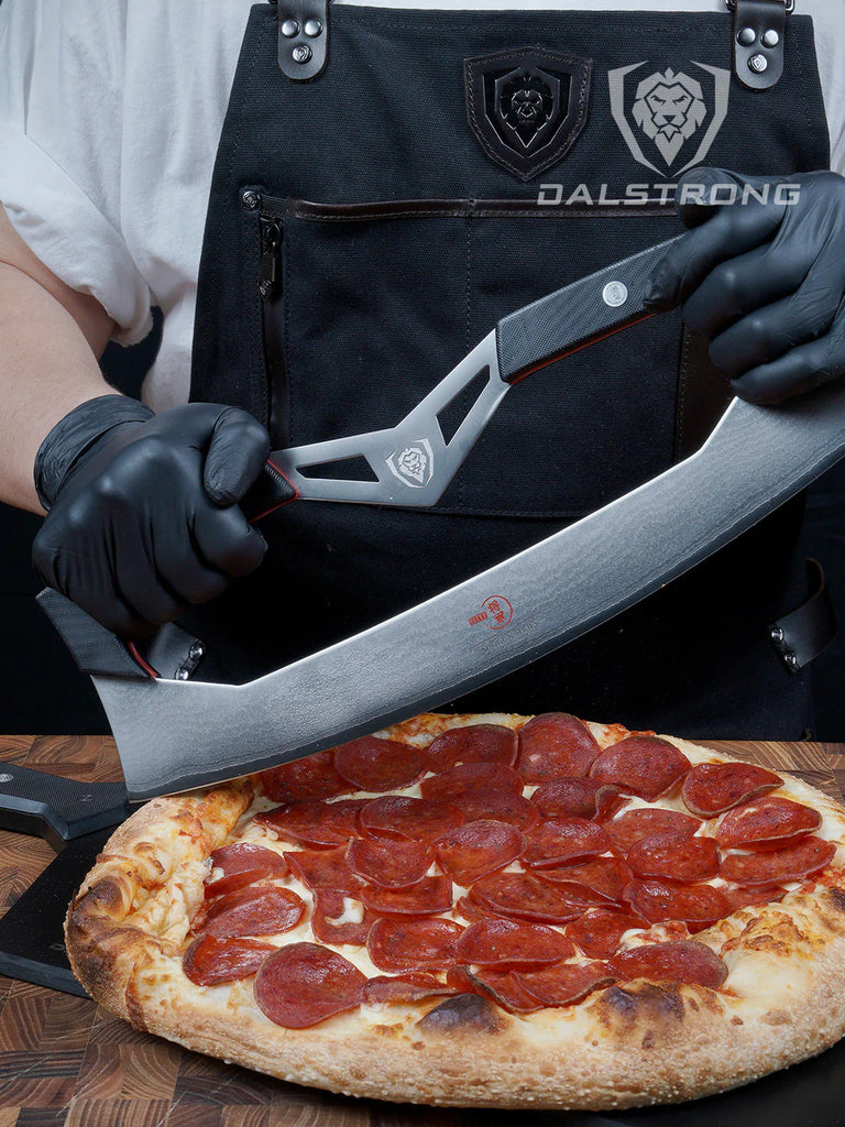 A man holding the Pizza Knife 14" Two Handed Blade Display Wall Mount Shogun Series ELITE LIMITED EDITION Dalstrong with a pizza.