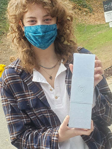 C-Cap student holding Dalstrong product box that was awarded to her