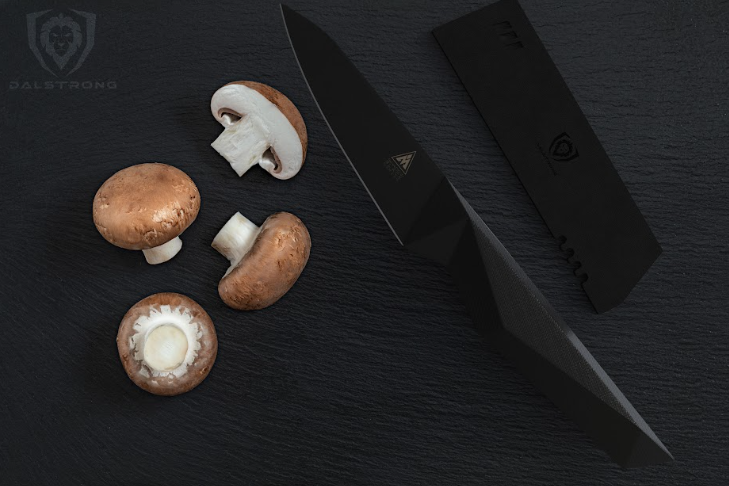 A photo of the Paring Knife 3.75" Shadow Black Series NSF Certified Dalstrong with four mushrooms.