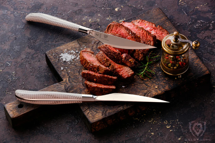 Premium Photo  Raw pieces of beef on a cutting board with a knife
