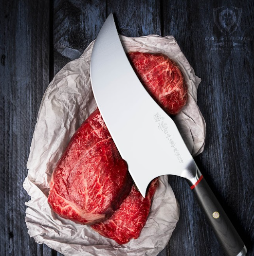 A photo of the Cleaver 9" The Banshee | Phantom Series | Dalstrong on top of a huge meat.