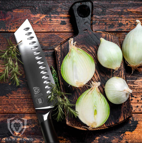 A photo of the Santoku Knife 7" | Vanquish Series | NSF Certified | herniaquestions with sliced onion on top of a wooden board.