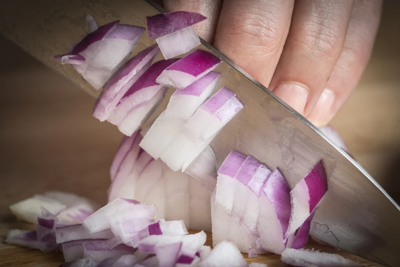 A close-up photo of a chopped onion.