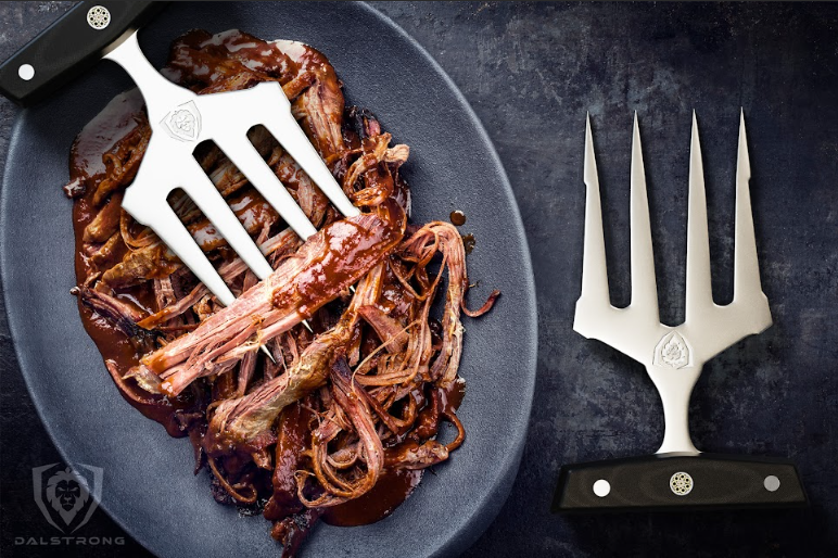 A photo of the Meat Shredding Claws | Dalstrong with shredded meat in a plate