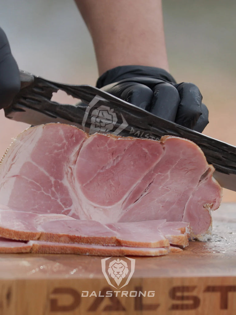 Dalstrong Barbarian Series Slicing & Carving Knife slicing a huge cut of meat.