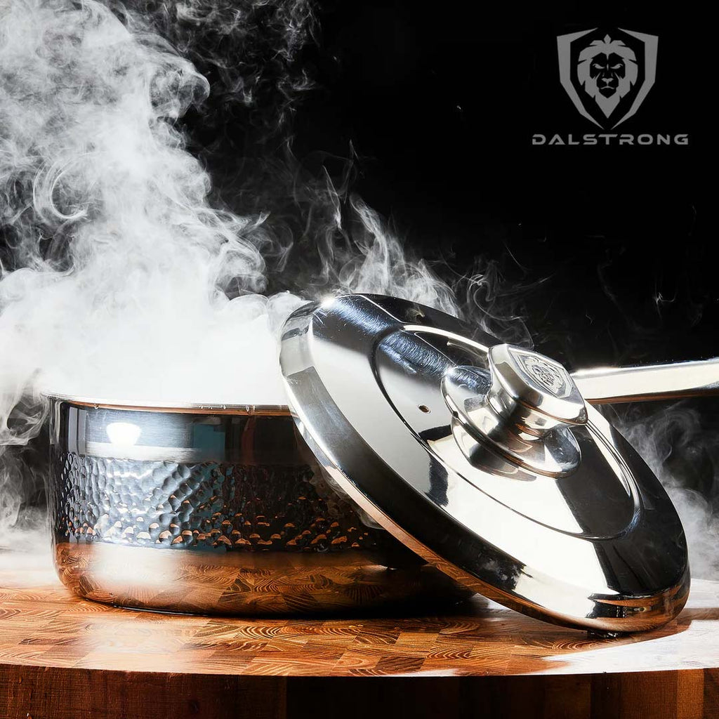 A photo of the 3 Quart Stock Pot Hammered Finish Silver | Avalon Series | Dalstrong with smoke coming out of it.