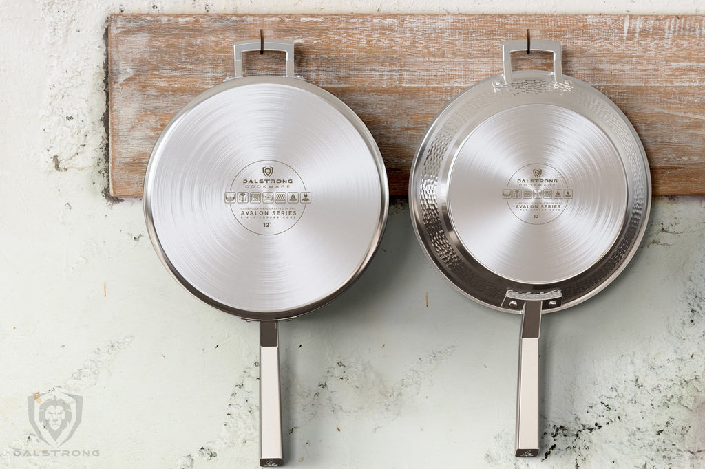 A stainless steel pot and frying pan dangle from hooks on a wooden kitchen rack
