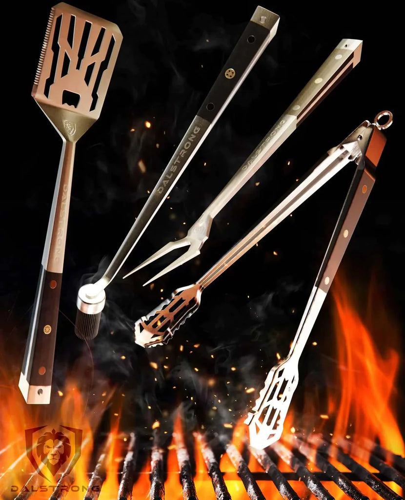 Tongs, Spatula, Fork, Silicone Brush | 4 Piece Premium Grill Kit | Dalstrong on a burning grill.