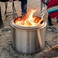 Metalic bonfire in the centre of a campground circle 