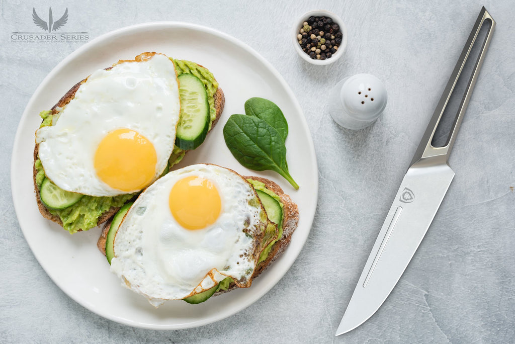 A plate of eggs set on a table beside salt, pepper and a stainless steel steak knife