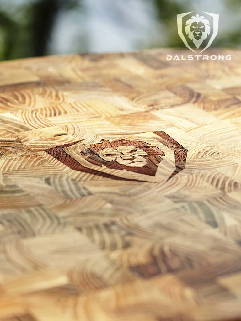 A close-up photo of the Corner Cutting Board | Natural Teak Wood | Dalstrong