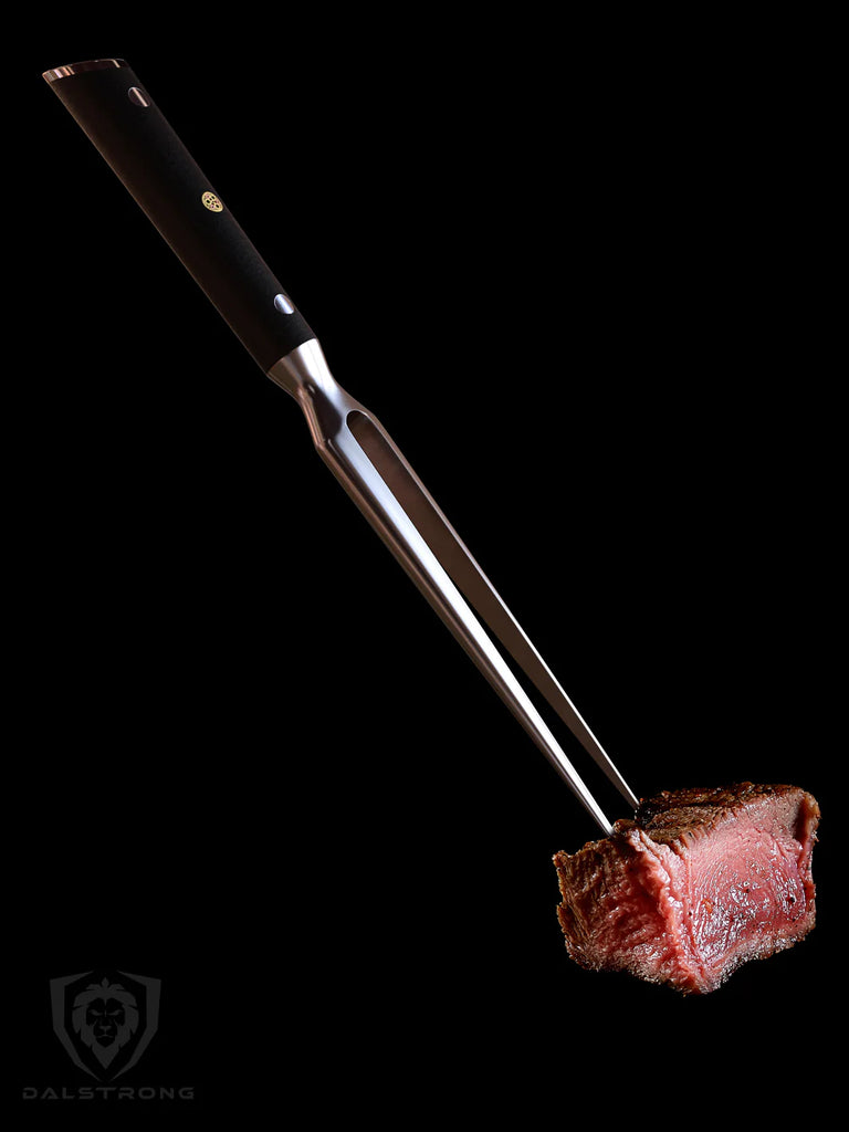 The Impaler Meat & Carving Fork 7" with a steak on the tip.