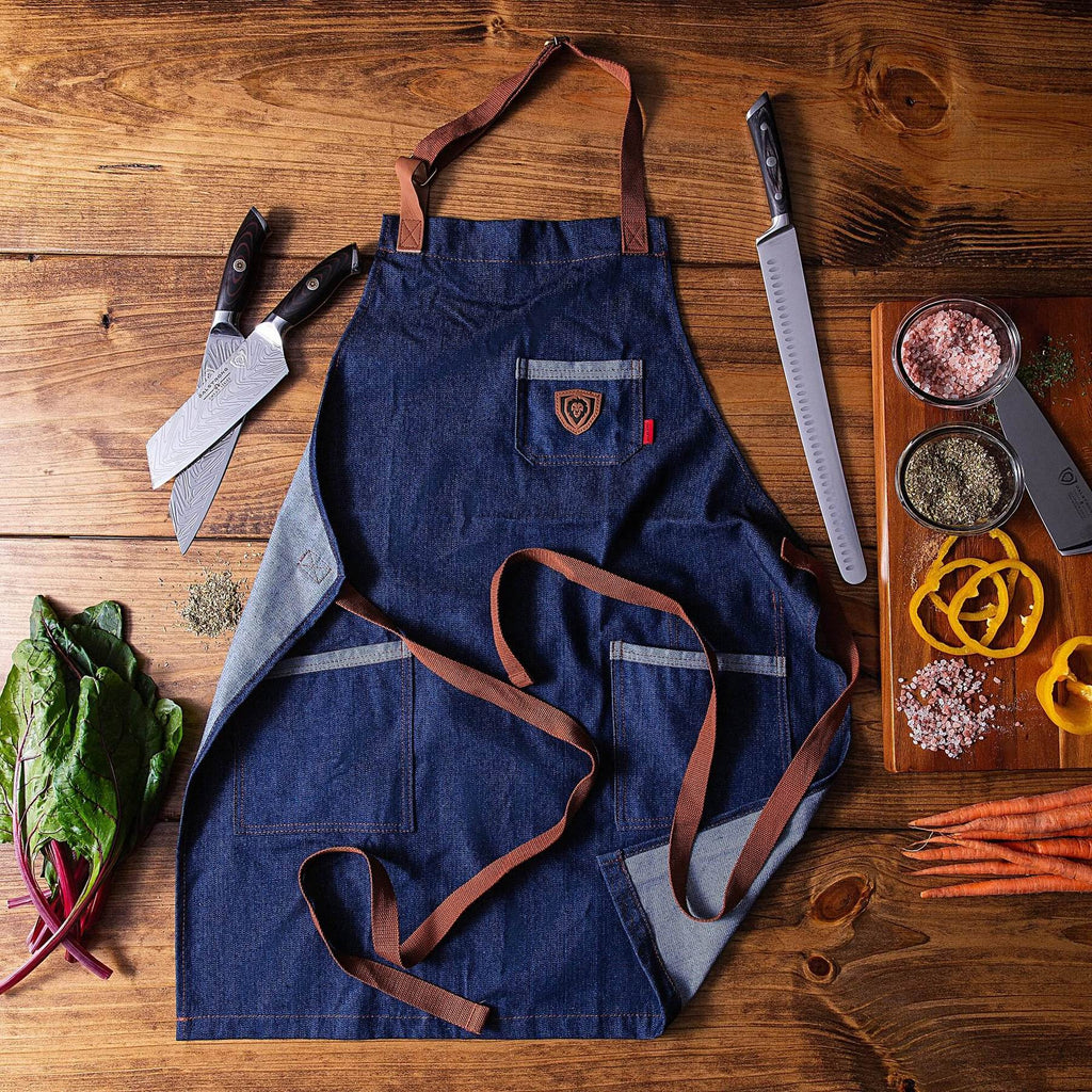 Dalstrong American Legend | Blue Denim | Professional Chef's Kitchen Apron laid out on a wooden table 